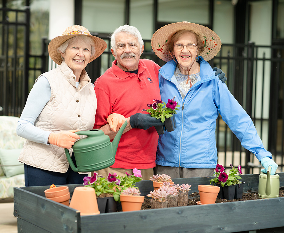 residents gardening in the Christopher Center courtyard