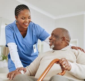 happy senior man with friendly nurse