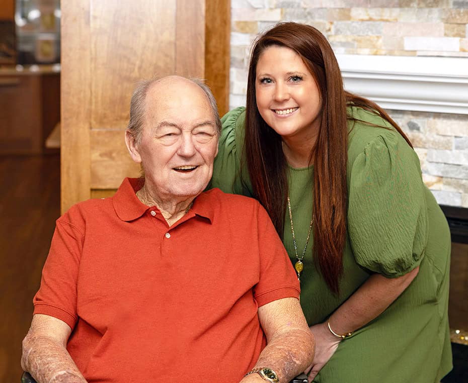 team member and resident smiling